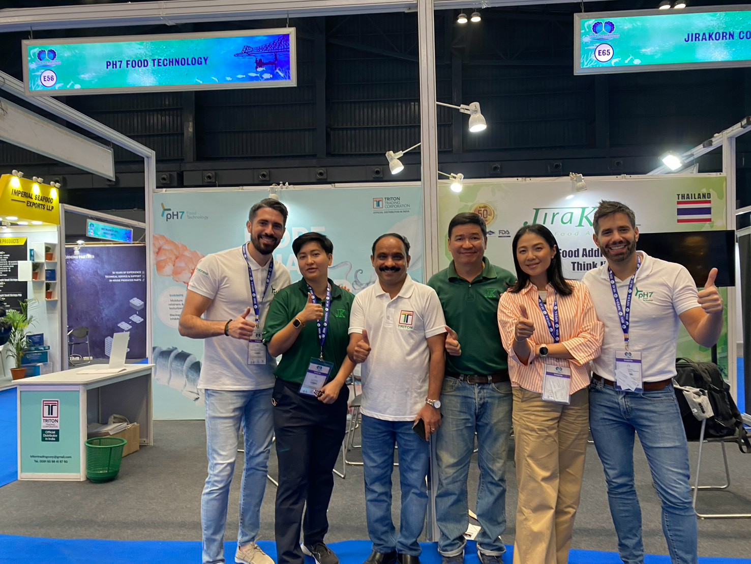 Jirakorn team with international partners at a trade exhibition
